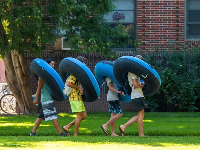 Floaters cross UM’s campus bound for the Clark Fork River.