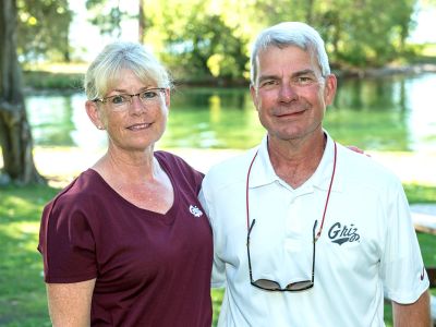 Mary Olson and her husband, Greg, in Griz Gear.