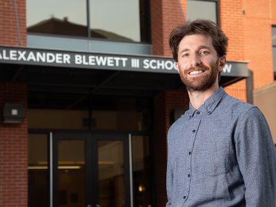 A picture of Noah Goldberg-Jaffe in front of the Law Building