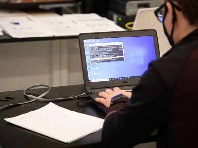 A student works at a computer.