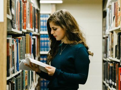 A picture of Reema Najjar in the library of UM's Law Building.