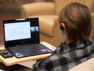 Student sitting at a laptop