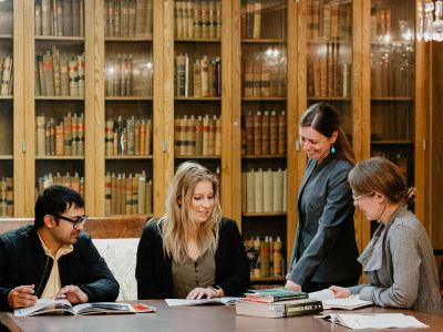 Sara Rinfret, director of UM’s Department of Public Administration and Policy, works with students.