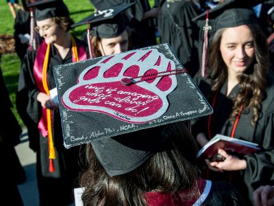 Photo of a mortar board with Griz paw on it.