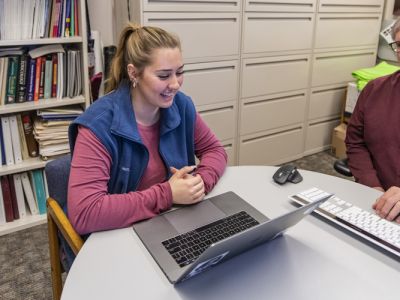 A faculty member advises a student 