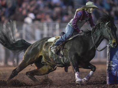 A photo of Ashtyn Carlson competing in barrel racing. 