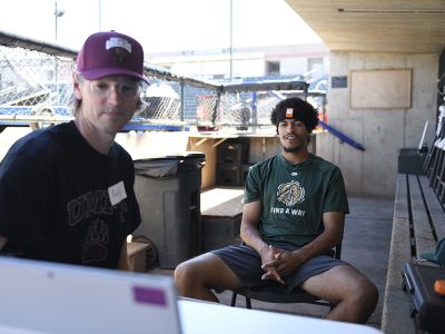 UM researcher Andy Kittelson (left) works with a Paddlehead player.