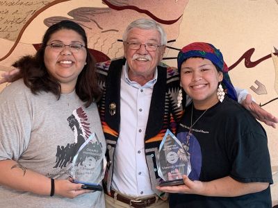 . Pictured are (left to right) chapter President Millie Bearleggins, adviser Dr. Larry Gianchetta and Vice President Omaste-win Foster.