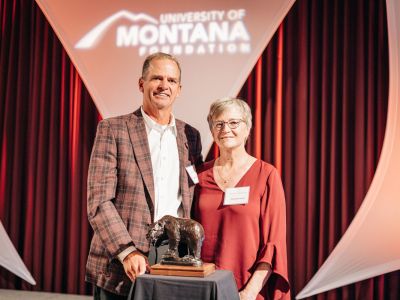 A picture of Mark and Cheryl Burnham with the Order of the Grizzly Award. 