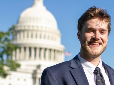 Nick Mills poses for a photo before the U.S Capitol building.