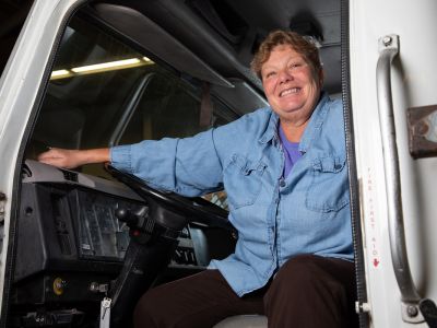 Photo of Renee Kelly in a semi cab.