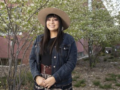 Courtney Little Axe posses for photo by Payne Center