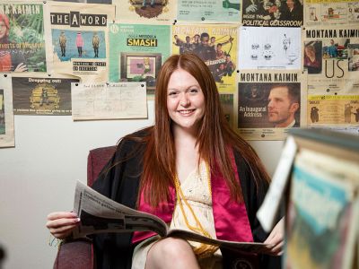 Mariah Thomas poses for a picture with her Montana Kaimin covers.