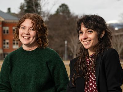 Two UM students sit on campus