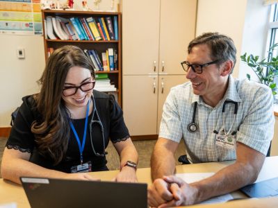 Dr. Rob Cruikshank works with a resident at Partnership Health Center in Missoula.