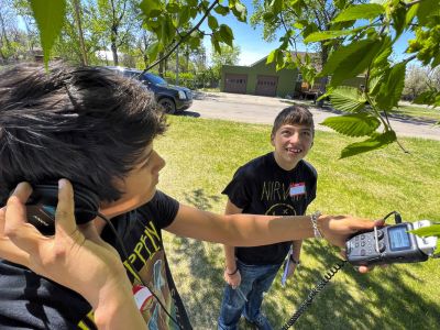 Two Montana Media Lab students work with audio equipment.