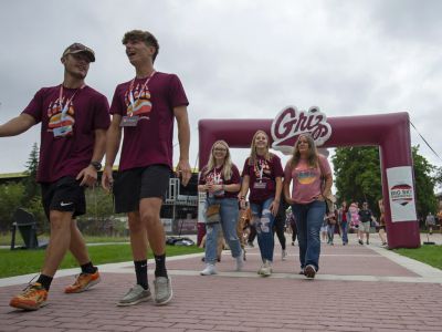An image of UM students walking outside during the Big Sky Experience.
