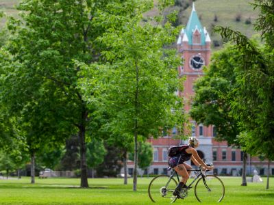 Student bikes across the UM campus