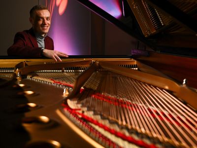 A picture of UM law student Vance Thuesen at the piano.