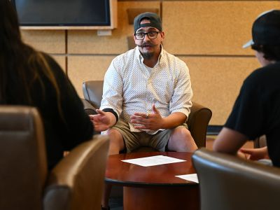 Cody Munson meets with students in the Payne Family Native American Center.
