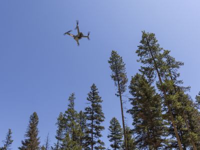 An image of a drone in the sky. 