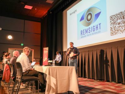 UM student Stephen McLaughlin, of Remsight, talks to judges and audience members during the 2025 John Ruffatto Startup Challenge. 