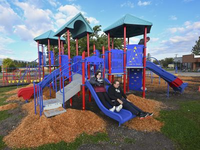 Griz Esports team members try out the slide they helped fundraise for.