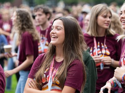 A UM student smiles during a campus event. 