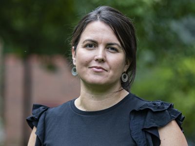 A female staff scientist at UM standing outside 