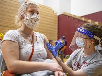 A female UM student receives the vaccine 