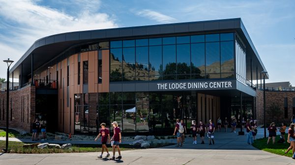 Students walk passed the new The Lodge Dining Center