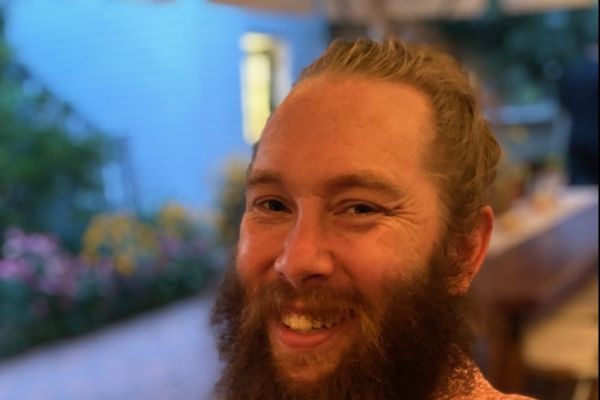 Ian smiling at the camera