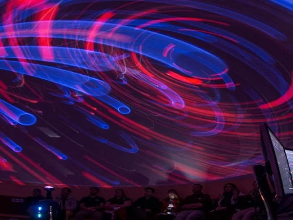 A student leads a presentation in UM's planetarium