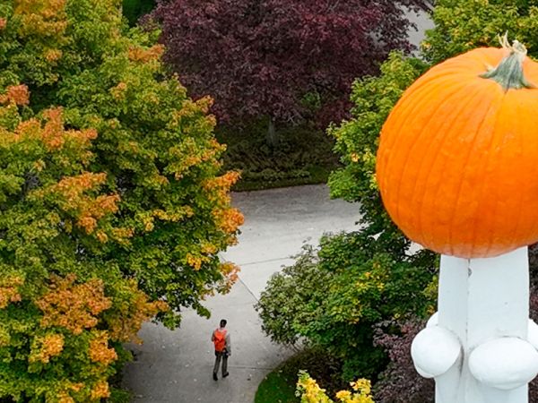 A pumpkin sits speared atop Main Hall