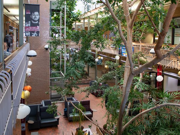 Indoor places and lounging areas in the University Center as seen looking down to the first floor atrium from the second floor.