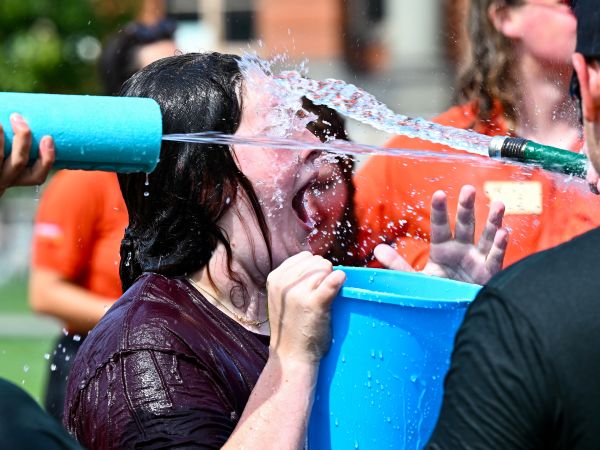 students playing with water during Freshman Float