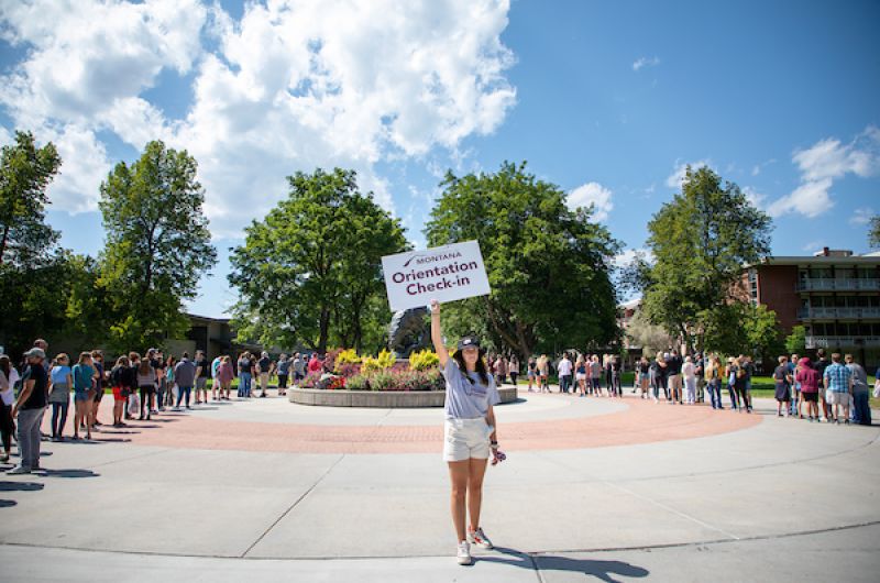 Jorgie poses with Orientation check in sign
