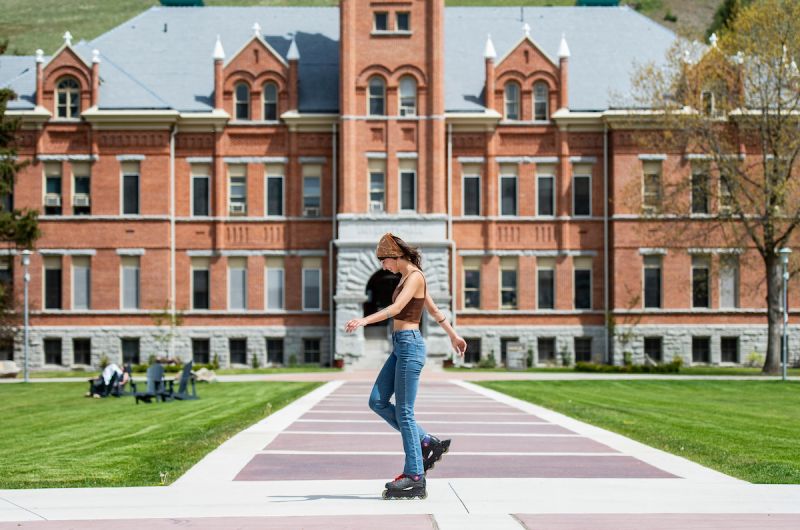 Girl roller skating on UM campus