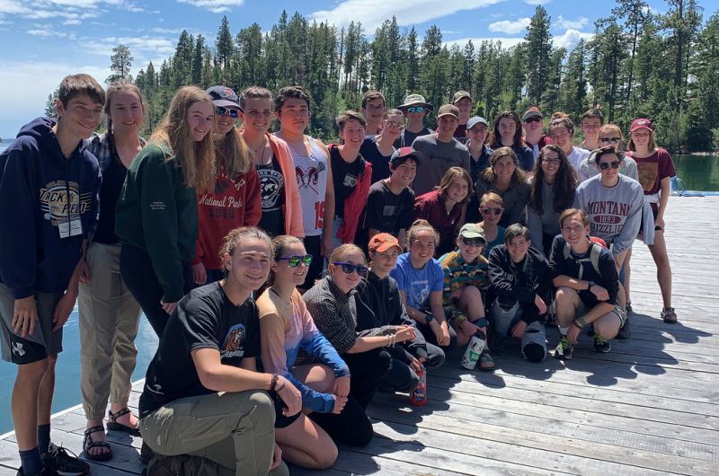 Schwanke participants posing for group photo on  a dock on Flathead Lake