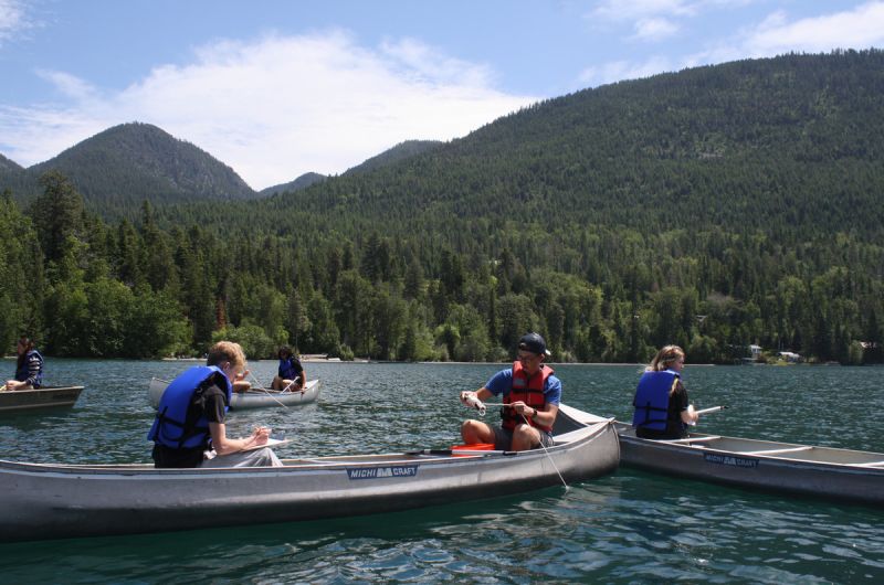 Schwanke participants in canoes doing research on Flathead Lake