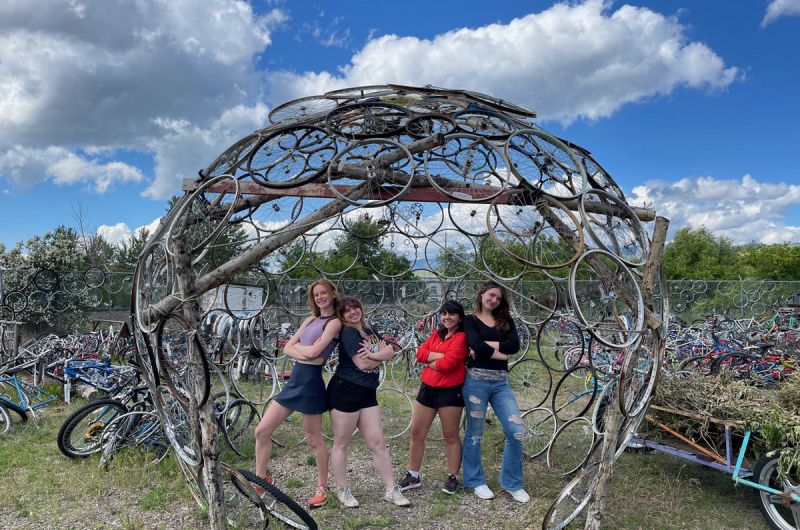 Schwanke participants standing inside dome sculpture made out of bikes