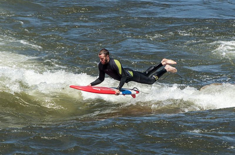 man surfing brennans wave in missoula
