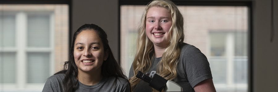 headshot of two students smiling for the camera